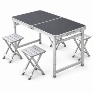 Dark gray folding camping table and silver metal folding stools on a white background